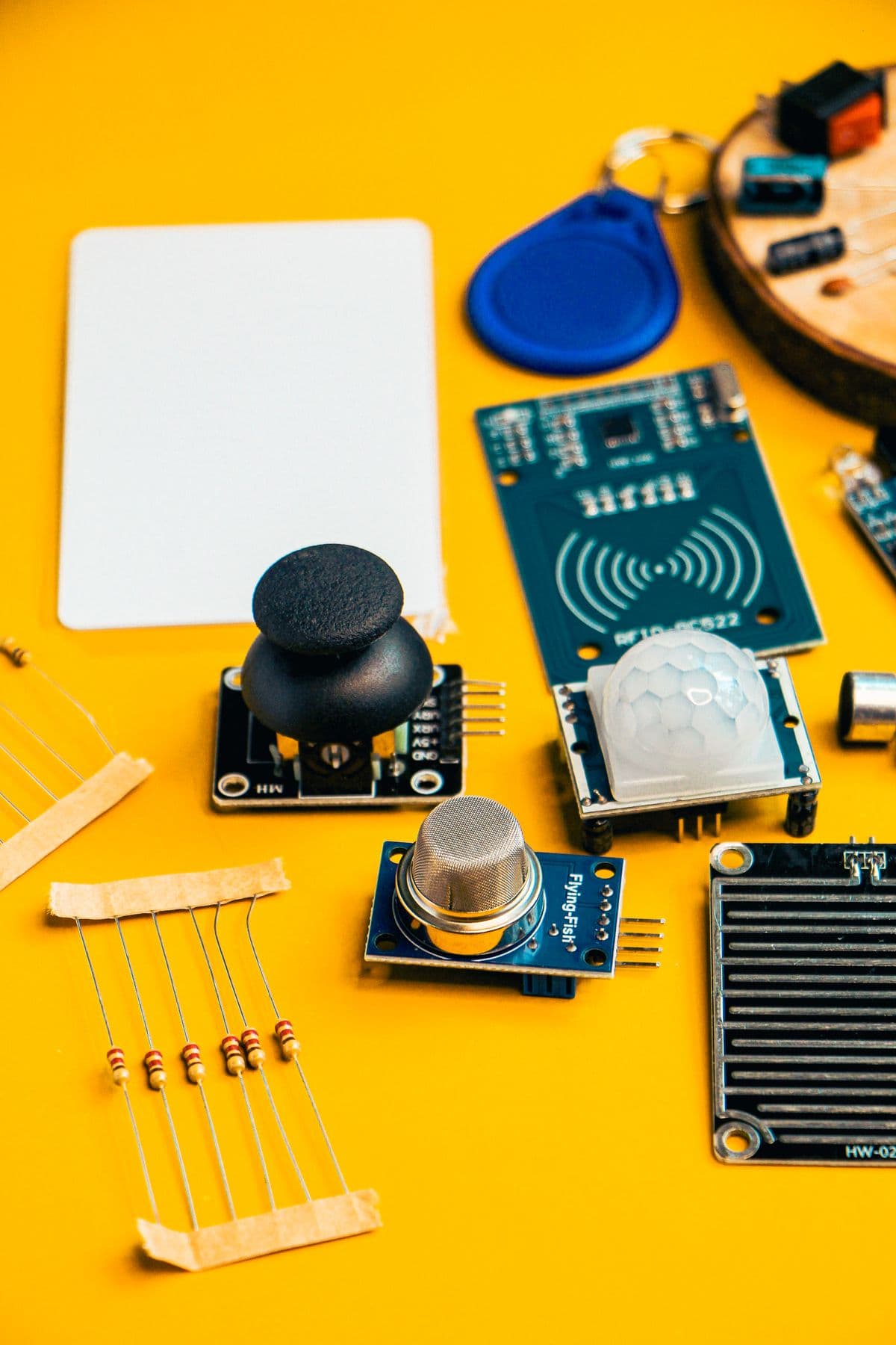 Set of electronic sensor modules laid out before assembly